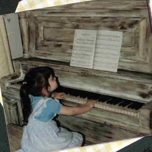 Me at the piano, age 3.