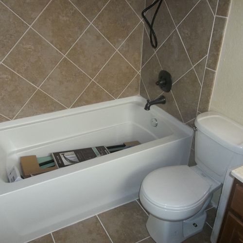 Bathroom demo, new tile, tub,stool, paint, vanity 