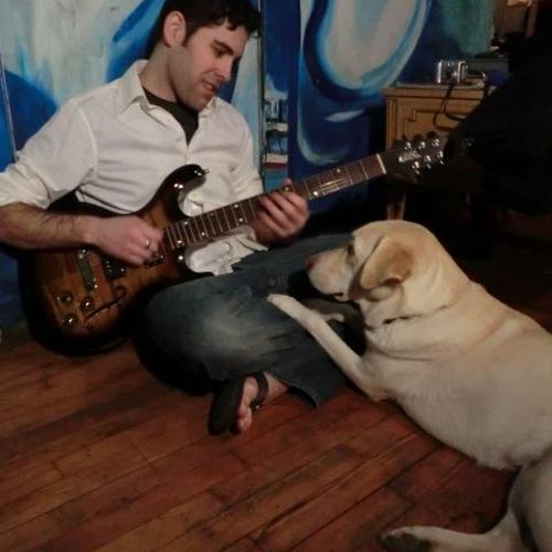 My dog Lily, a guitar I built and me.