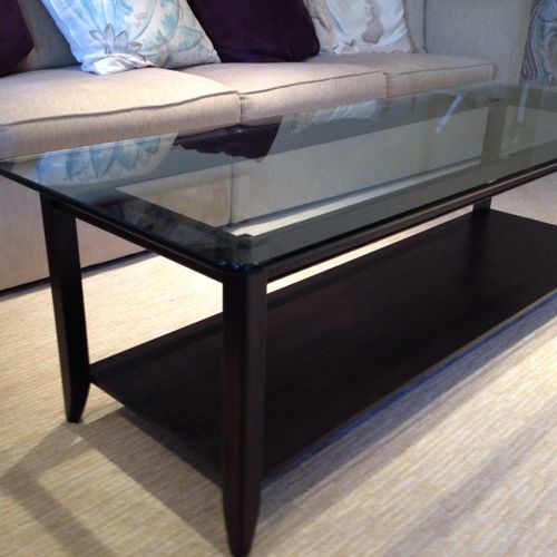 Extended length coffee table of ebony stained maho
