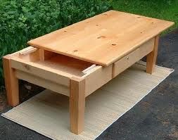 Pine coffee table with sliding top for storage