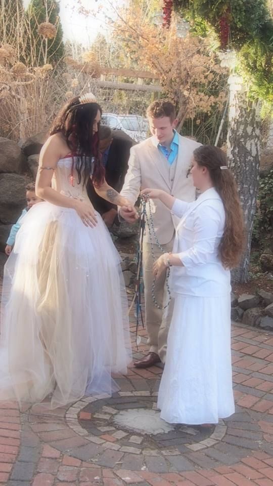 Wrapping of the hand fasting cord.
