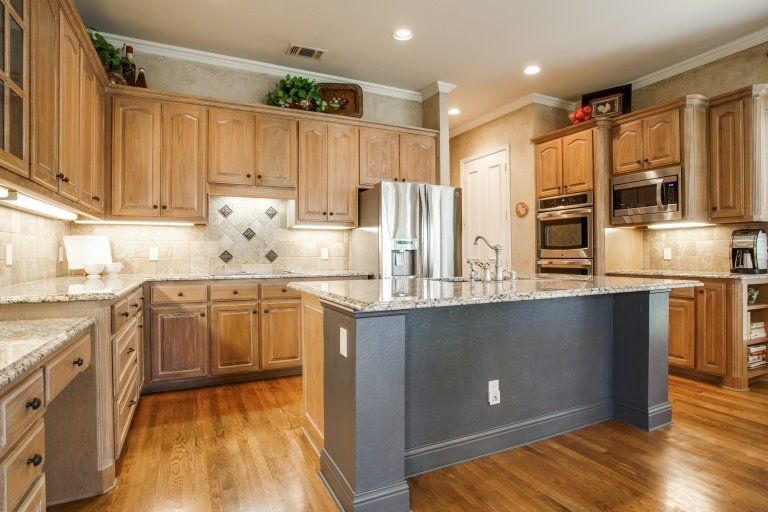 Kitchen remodel.  Island was cut down, travertine 