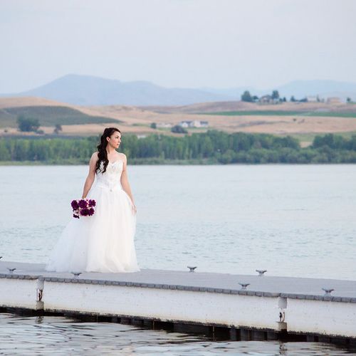Bride standing on dock at Lake Lowell in Nampa, Id