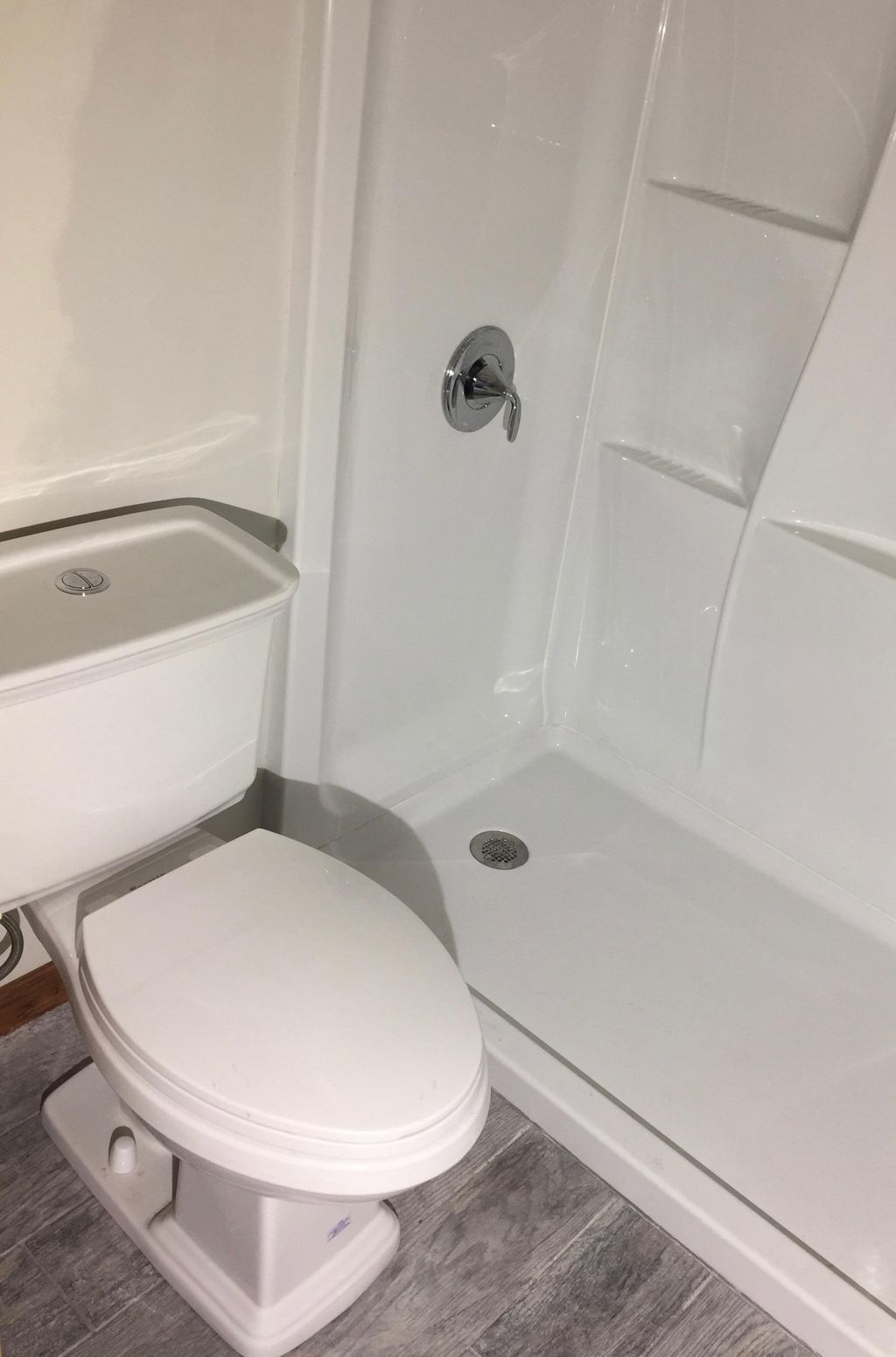 Brand new shower surround, toilet, and barn wood s