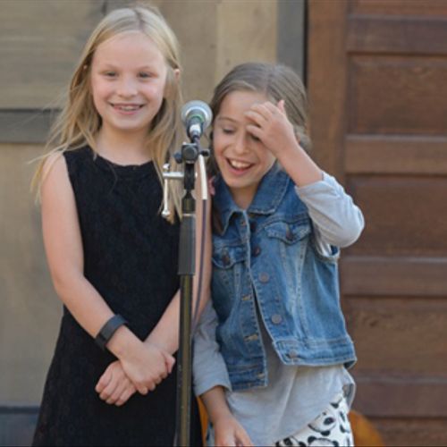 Caitlin and Olive enjoying performing at an event