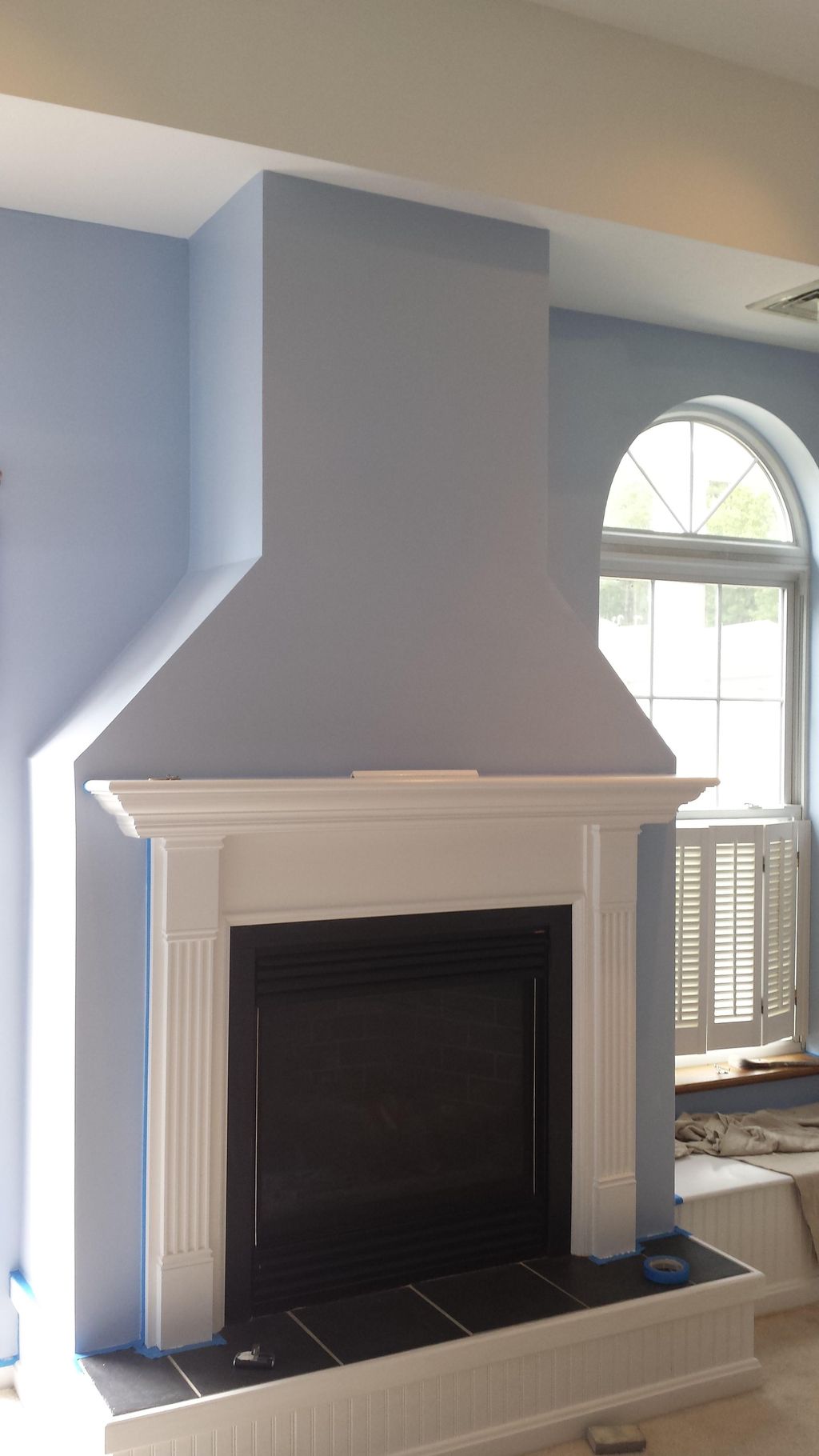 Fireplace mantel installed and painted