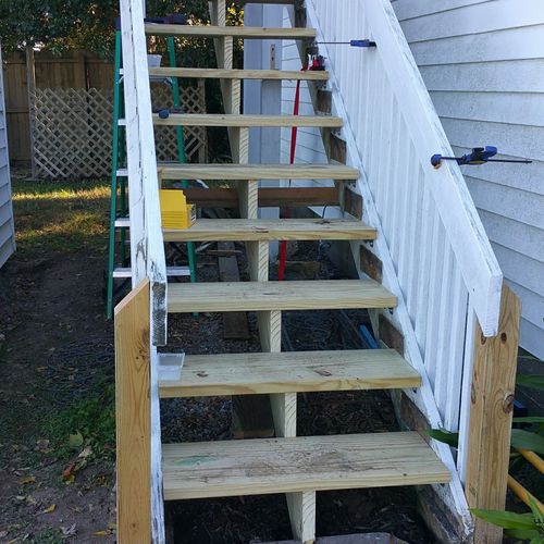 Rebuilt stairs with added center stringer and post
