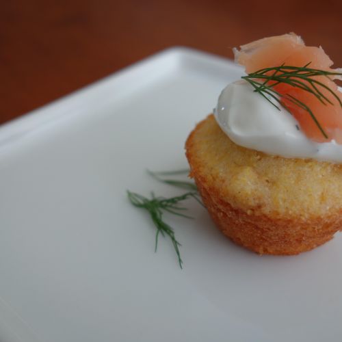 mini cornbread topped with cream and smoked salmon