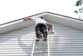 replacing old wood boards on a wooden house