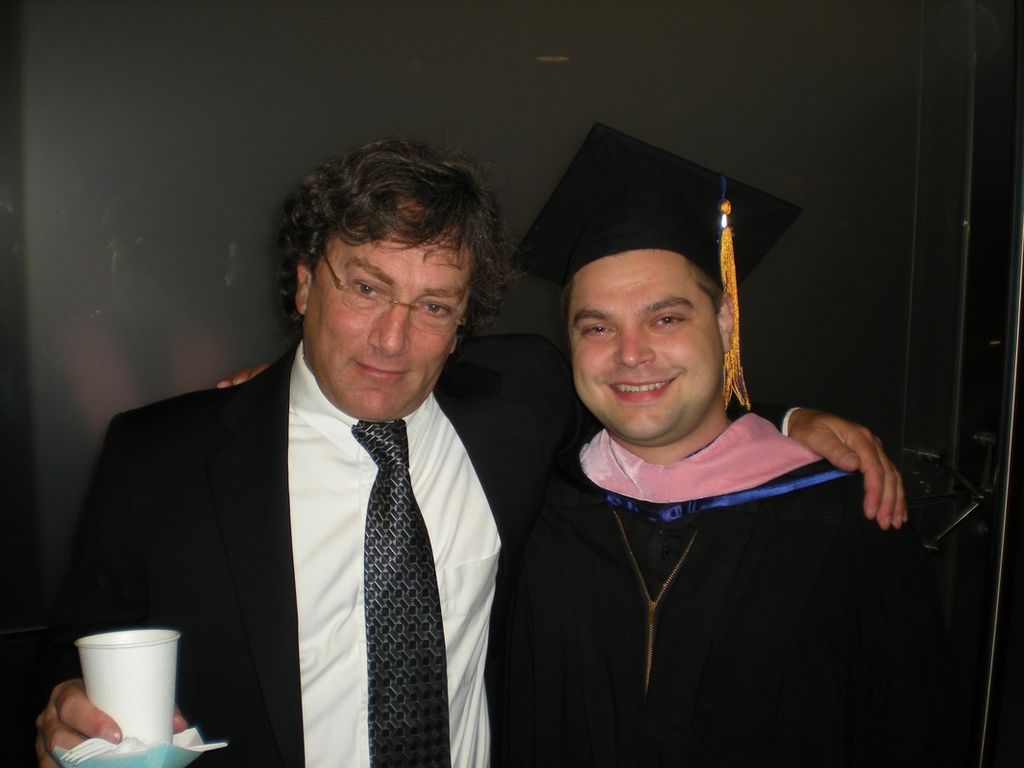 Graduation photo with classical guitarist and teac