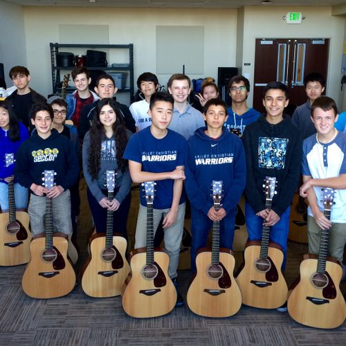 Reggie teaches guitar at Valley Christian School i