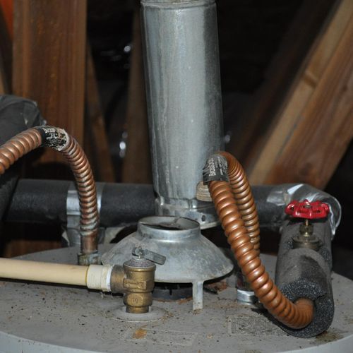 Exhaust flue disconnected discharging into attic (