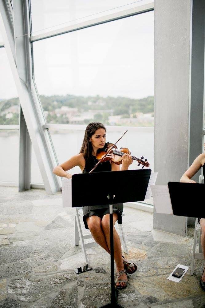 Caroline performing in a wedding string quartet