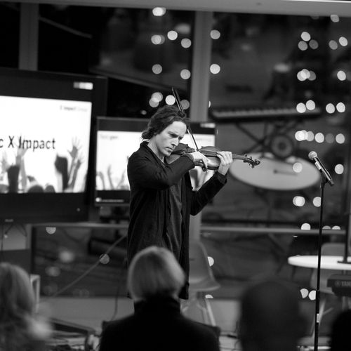 Acclaimed violinist Tim Fain performing at an even