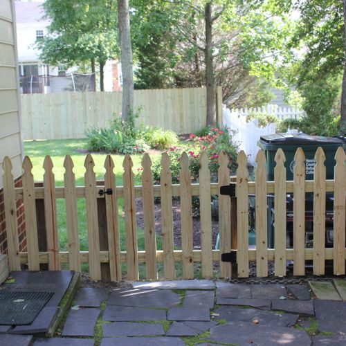 Custom wood picket fence repair and installations.