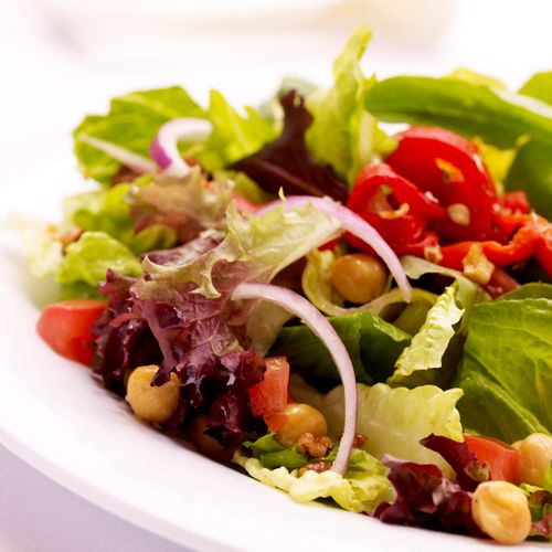 Mixed lettuces with garbanzo beans, roasted red pe