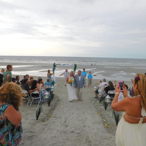 Wedding on the beach with arbor, music, minister, 