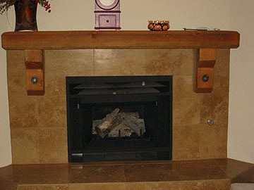 Ceramic tile with wood mantel and accents.
T. Simo