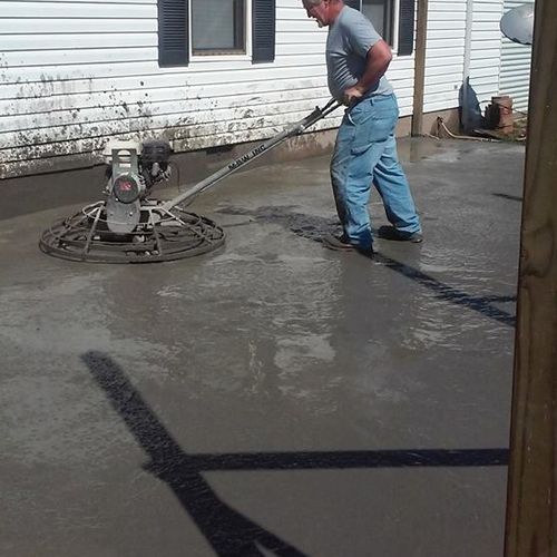 smoothing out cement for patio