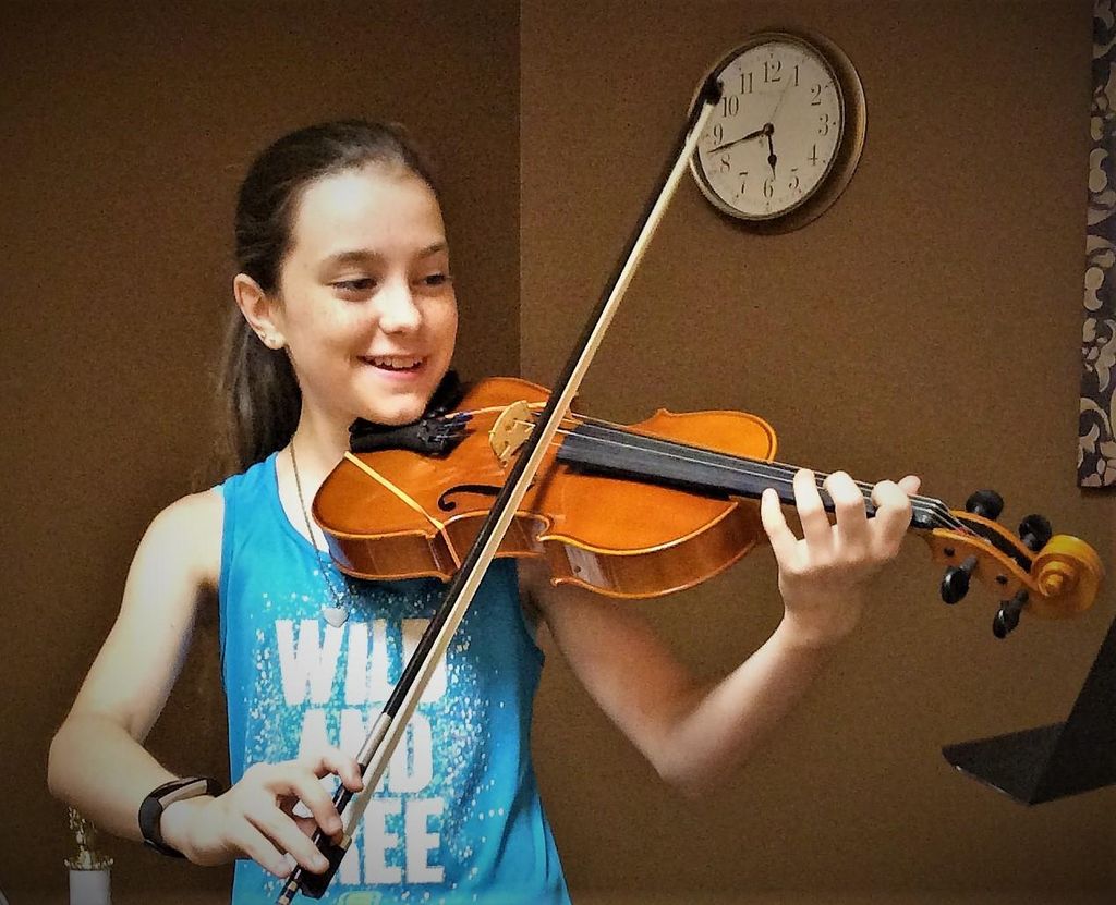 Irene giving awesome violin lessons