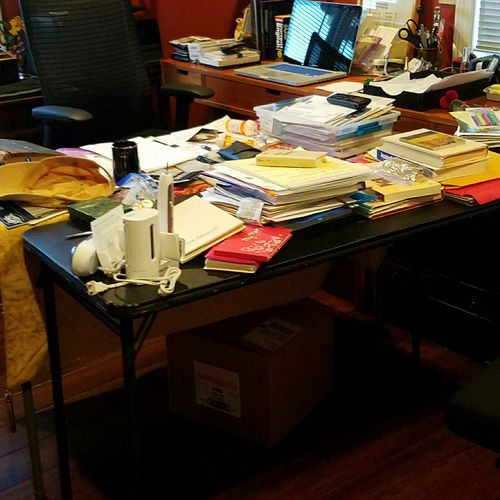 A month of clutter piled up.  Client buried and ov
