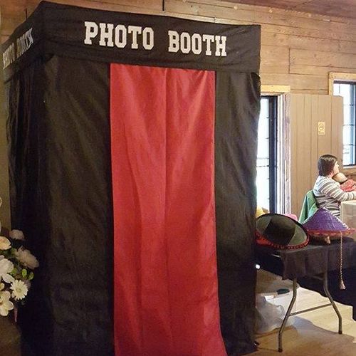 Enclosed photo booth fits up to 6 guests.
