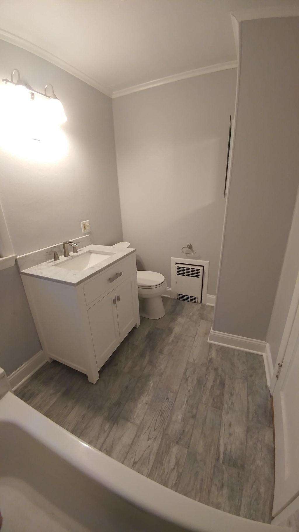 AFTER: New Vanity, Toilet Base Molding & Paint