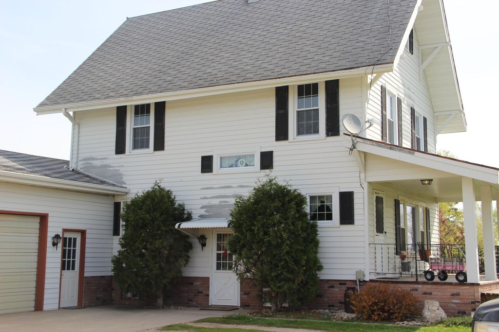 another older farmhouse with t-lock shingles