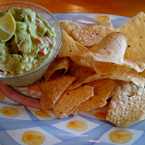 Creamy and spicy guacamole with tortilla chips
