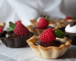 Dark Chocolate mini tarts with fresh raspberries.