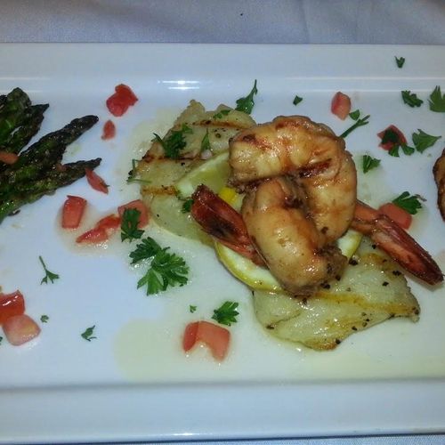 Shrimp & Grilled Sea Bass served with Asparagus an