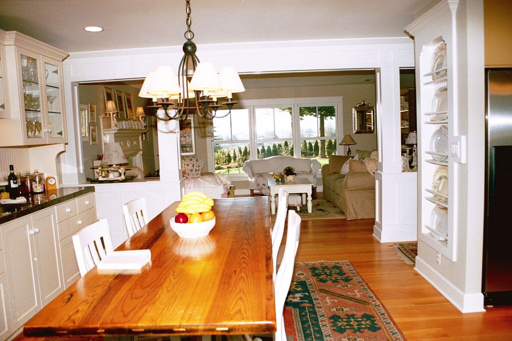 Removed wall is replaced by craftsman style posts,