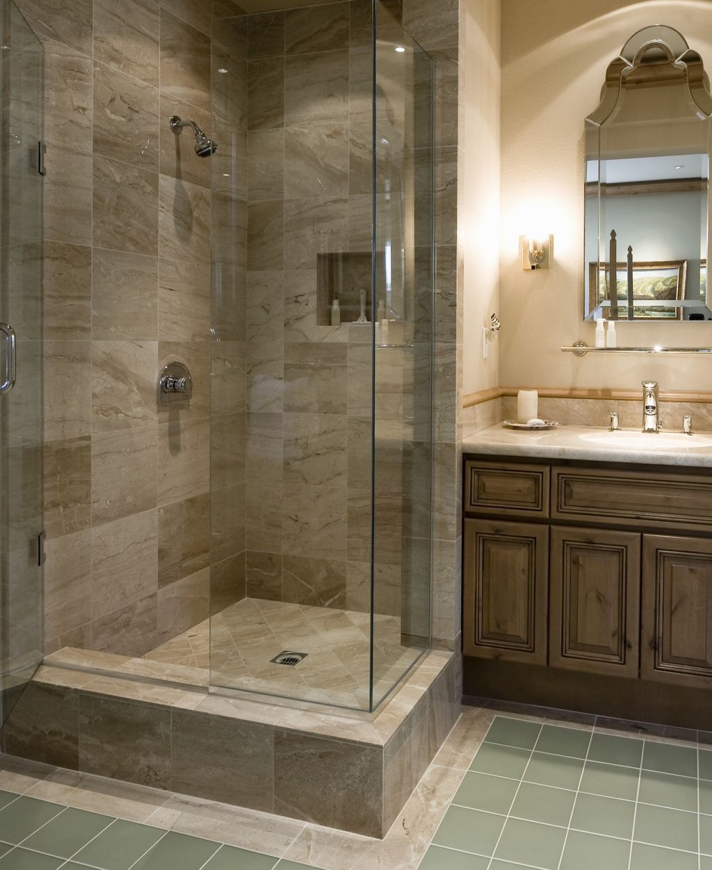 Nice corner shower in 12" marble w/frameless door.