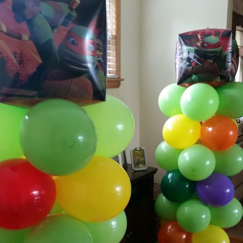 Multi-colored Balloon column with Ninja Turtle Cub