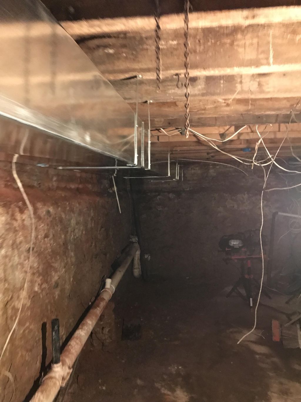 Trunk duct installation in unfinished basement 