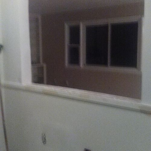 A window  to open up a wall between kitchen and li