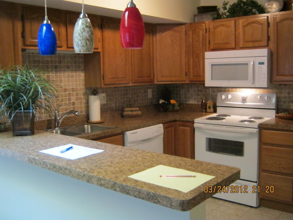 New kitchen cabinets, counter tops and new tile be