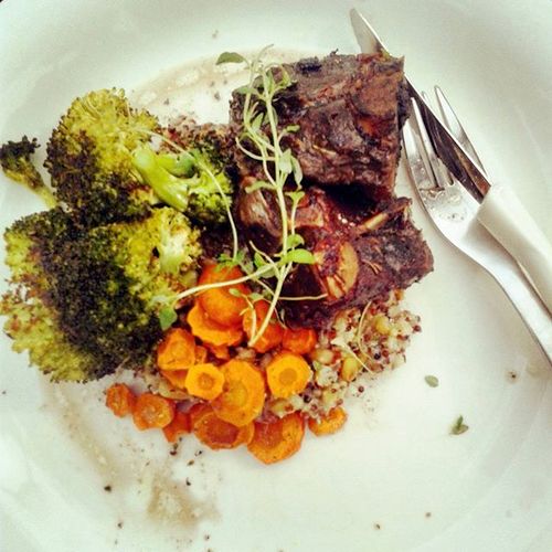 Lamb with roasted broccoli, carrots, and quinoa wi