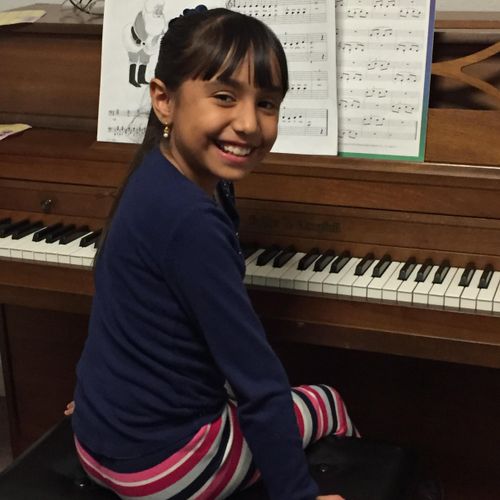 Piano student Alexa R. loves her lessons and it sh