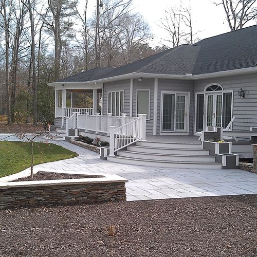 Paver slab patio with natural stone planters, Low-