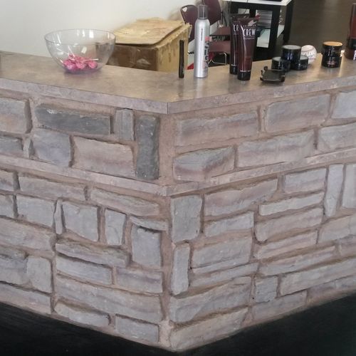Stone veneer on front reception desk at a barber s