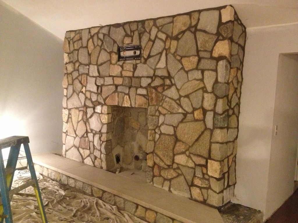 Custom Thin stone fireplace, built for stove inser