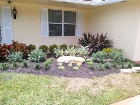 Front of house- Full remodel, placed stones, plant