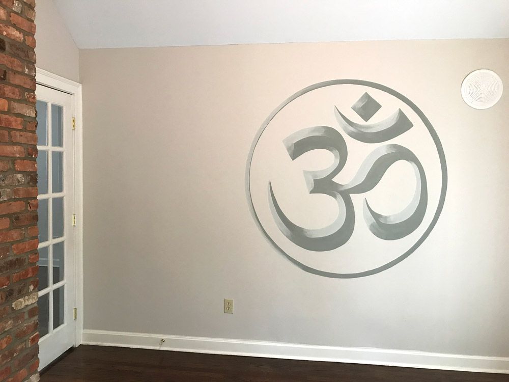 The symbol for "ohm" painted on the wall of a priv