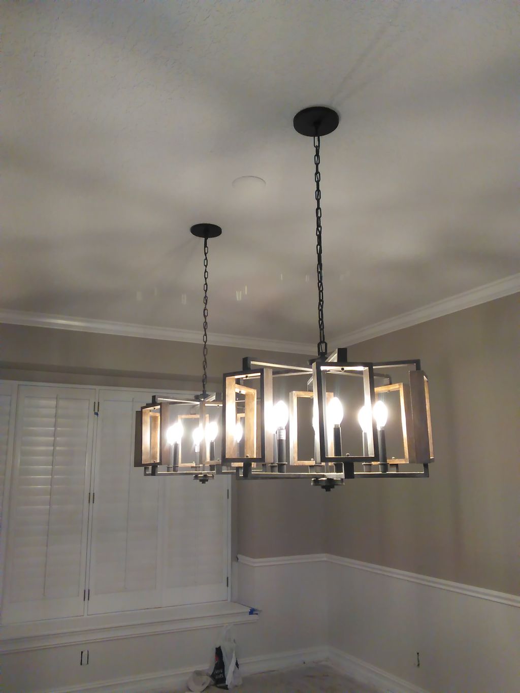 upgraded to 2 chandeliers in formal dining room in