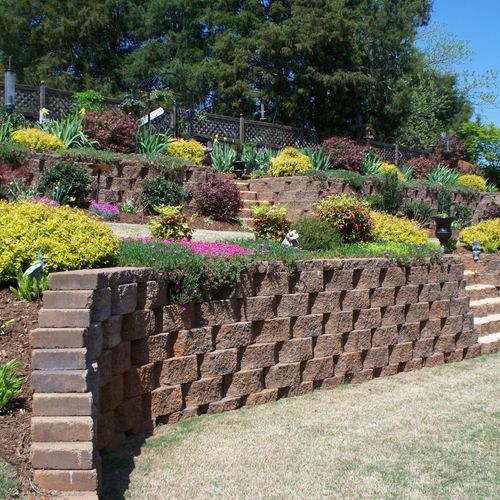 Full color landscaping and beautiful retaining wal