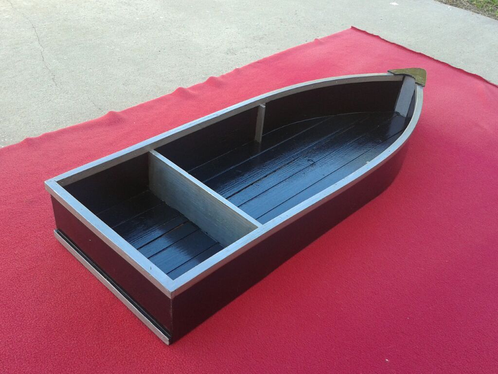 Restoration of decorative boat.
