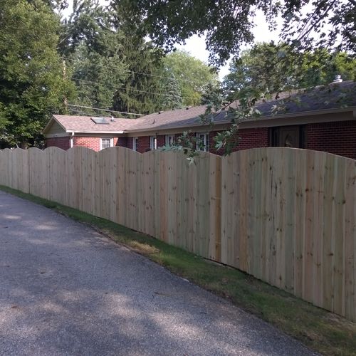 6 ft. treated privacy fence w/ arch tops finished.