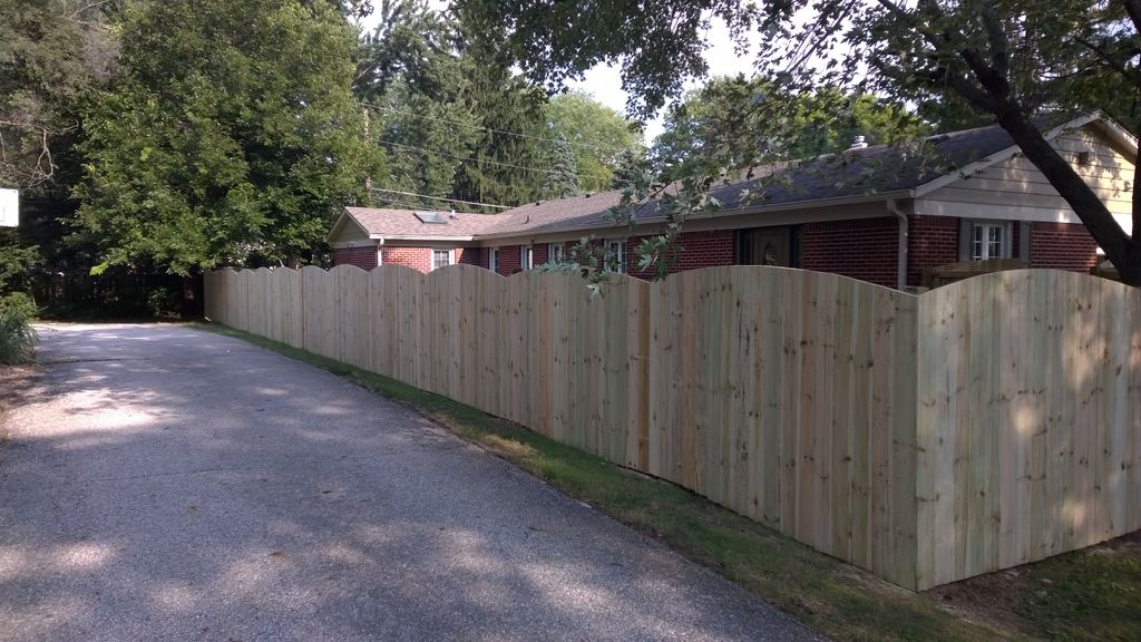 6 ft. treated privacy fence w/ arch tops finished.